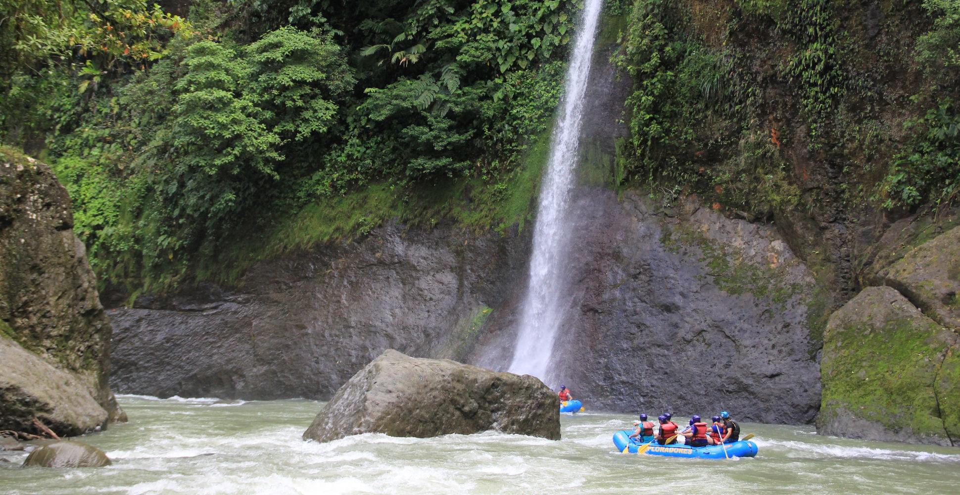 Raft passing waterfall on the Pacuare River